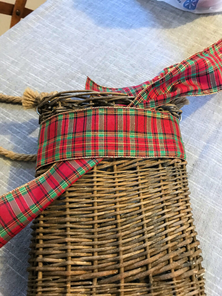 tying a bow on a basket