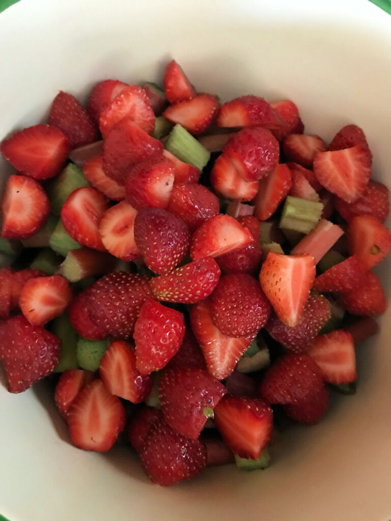strawberries and rhubarb in a saucepan