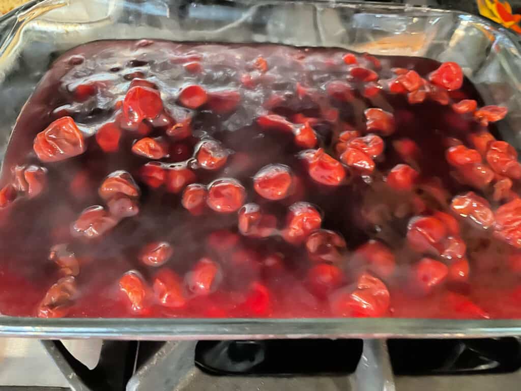 cherries and filling in a large baking pan